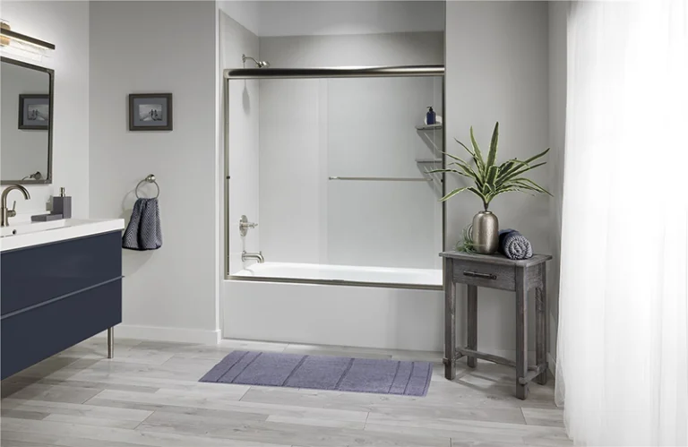 Gray bathroom with tub and shower.