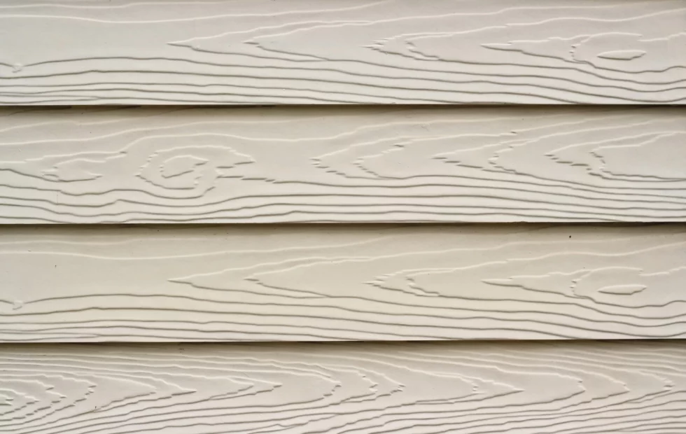 Close up of beige fiber cement siding.